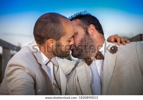 handsome gay men kissing