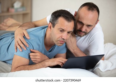 A Gay Couple Working On Pc