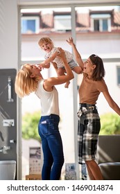 Gay Family With Smiling Child Girl In Store For Household
