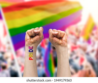 Gay Guy's Hand With A Tattoo That Says Pride With White Background. Symbol Of Sexual Liberation And Tolerance