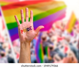 Gay Guy's Hand With A Tattoo That Says Pride With White Background. Symbol Of Sexual Liberation And Tolerance