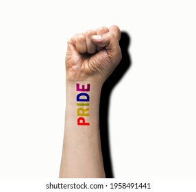 Gay Guy's Hand With A Tattoo That Says Pride With White Background. Symbol Of Sexual Liberation And Tolerance