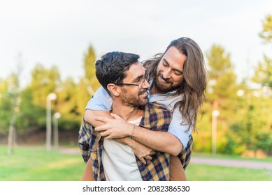 Gay Male Couple Having A Good Time In The Park