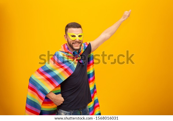 https://image.shutterstock.com/image-photo/gay-man-holding-lgbt-flag-600w-1568016031.jpg