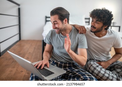 Gay Men Using Their Laptop For Skype Communication