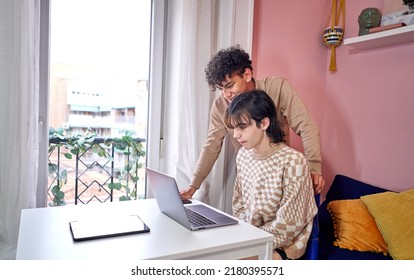 Gay Multiethnic Couple Couple Looking At Laptop