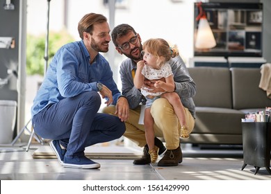 Gay Parents With Child Girl In Store For Household