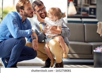 Gay Parents With Child Girl In Store For Household