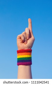 Gay Pride Concept. Pointing Hand With Gay Pride LGBT Rainbow Flag Wristband