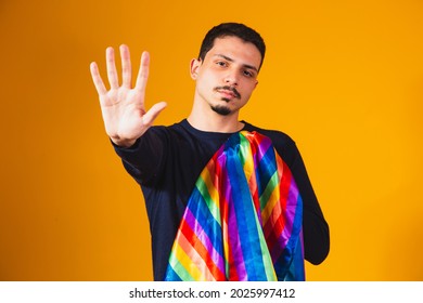 Gay Pride. Homosexual Boy With His Hand Forward Making A Stop Sign To Prejudice