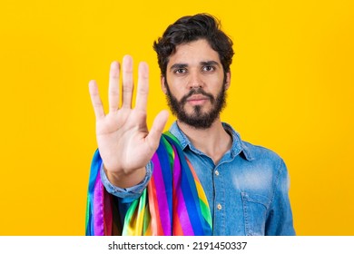 Gay Pride. Homosexual Boy With His Hand Forward Making A Stop Sign To Prejudice