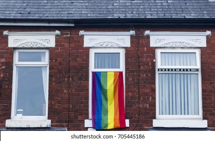 Gay Pride LGBTQ Flag Flying From A House Window