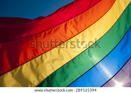 Gay pride rainbow flag fills the frame for a colorful background