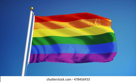 The Gay Pride Rainbow Flag Waving Against Clean Blue Sky, Close Up, Isolated With Clipping Path Mask Alpha Channel Transparency