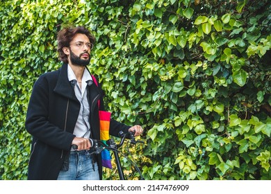 Gay Walking With Bicycle Near Green Plants