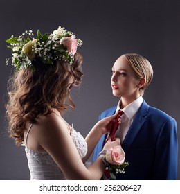 Gay Wedding. Bride Straightens Groom's Tie