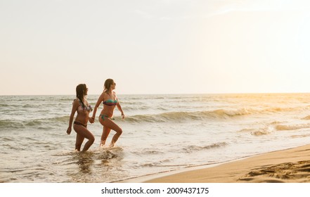 Gay Women Are Holding Hands And Coming Out Of The Sea