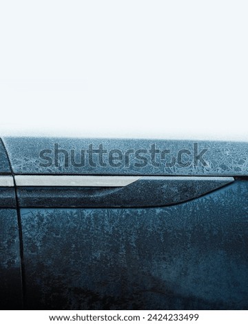 Gaydon, UK - Feb 11 2024 : Frozen detail closeup of a Range Rover velar HSE. JLR Luxury vehicle in cold weather. Side fender accent with black and gold covered in ice and frost