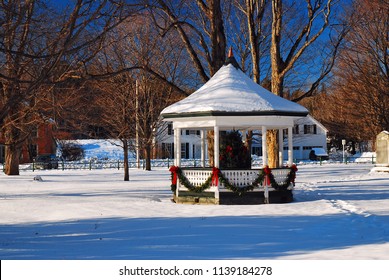 A Gazebo Is Decorated For Christmas On A New England Village Green
