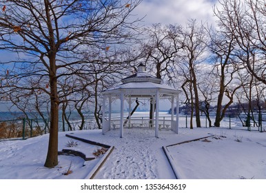 Gazebo In Lakewood Park, Ohio, In Winter With Cleveland Skyline