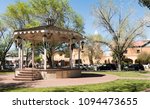 Gazebo in Old Town Albuquerque Plaza, and San Felipe de Niri Church. Old Town Albuquerque, New Mexico, USA.