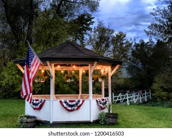 Gazebo In Park With American Flag And Bunting