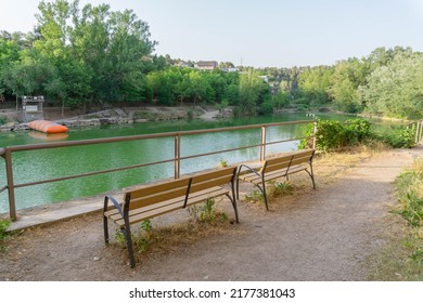 Gazebo With Two Chairs Facing Lake Navarcles