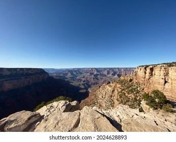 Gazing Into The Grand Canyon From The Edge Of The South Rim Trail