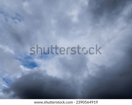 Gazing upward from below, cumulus and stratus clouds weave a tapestry across the autumn sky. The soft interplay of these cloud varieties creates a dynamic, atmospheric spectacle on a cloudy day