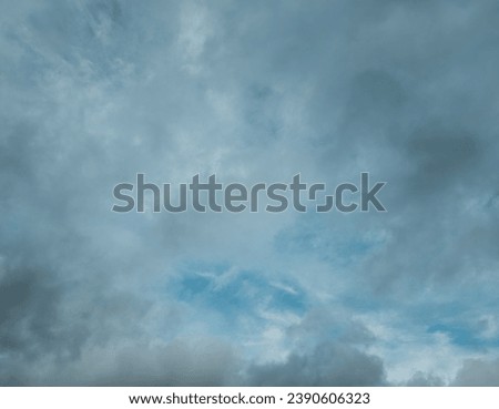 Gazing upward from below, cumulus and stratus clouds weave a tapestry across the autumn sky. The soft interplay of these cloud varieties creates a dynamic, atmospheric spectacle on a cloudy day