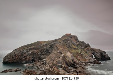 Gaztelugatxe islet with San Juan hermitage on top in Spain.s Basque Country is the real life location that features in TV series Game of Thrones as Dragonstone mystical island. Bermeo-Bizkaia-Euskadi. - Powered by Shutterstock