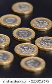 GBP British One Pound Coins Currency On A Black Background