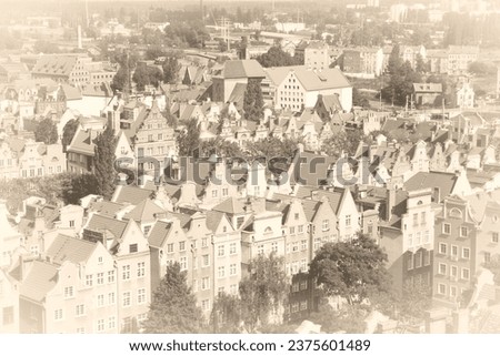 Gdansk city in Poland (also know nas Danzig) in Pomerania region. Old town aerial view. Retro postcard style sepia tone. Vintage faded paper style.