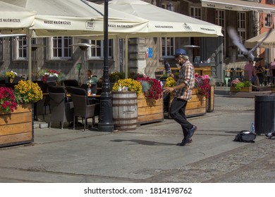 Gdansk, North Poland - August 14, 2020: An Old Man With Blue Hat Dressed Up As Hip Hop Trendy Clothing Listening To Radio And Performing Dance For Living