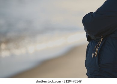 Gdansk, Poland: 26 02 2022: Religious Sister Prays At The Baltic Sea For Peace In The World