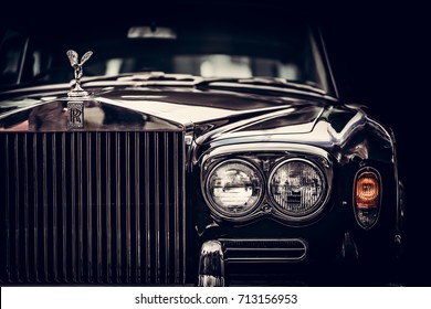 GDANSK, POLAND - September 8th. Rolls-Royce - classic British car on black background, close-up. Rolls-Royce remains a symbol of a luxurious car.