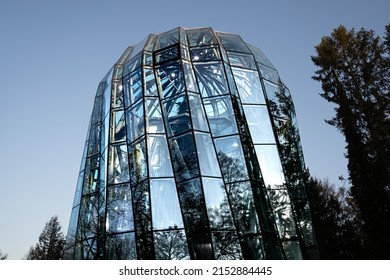 Gdansk,PL-15 Mar 22: Wide View Of Palm House In Olive Park Gdansk In Modern Design, Blue Clear Sky In The Background. Building Protecting Tropical Plants Collection By The Greenhouse Effect Inside