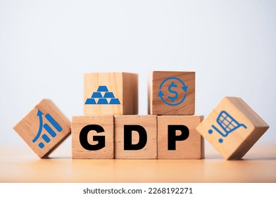 GDP or Gross Domestic Product wording print screen on wooden cube block with icons include graph dollar exchange shopping trolley and gold bar for economic recession concept.