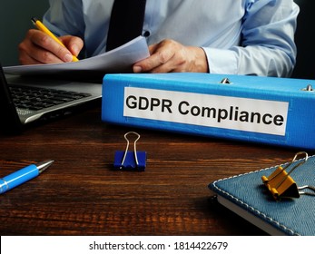 GDPR Compliance And Man Working With Papers.