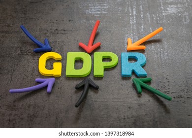 GDPR, General Data Protection Regulation concept, colorful arrows pointing to the word GDPR at the center of black cement chalkboard wall, important Europe data privacy regulation, rights of use law.