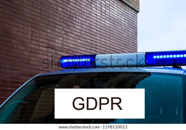 GDPR is a police car with flashing\
lights signed Data Protection . Cyber security and\
privacy