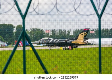 Gdynia, Poland - August 19, 2021. Fighting Falcon 88-0032 - TAI F-16C  operated by Turk Hava Kuvvetleri - Turkish Air Force - getting ready for start behind the fence