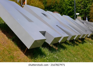 Gdynia, Poland - May 24, 2022: Large metal letters are arranged in the Arka Gdynia lettering. It is the name of a large Polish sports club, and its official date of establishment is considered to 1929