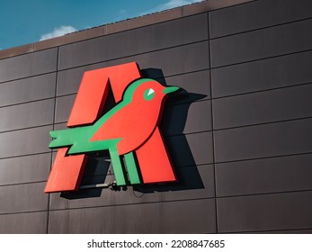 GDYNIA, POLAND - SEPTEMBER 29, 2022: Auchan Logo On A Shopping Centre Wall