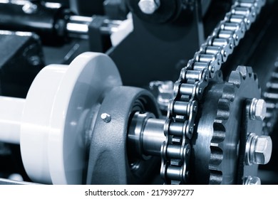 Gear chain drive shaft in conveyor belt is on production line. Timing chain of car, tensioners in engine. Industrial roller chain, technology. Team work, business industrial concept - Powered by Shutterstock