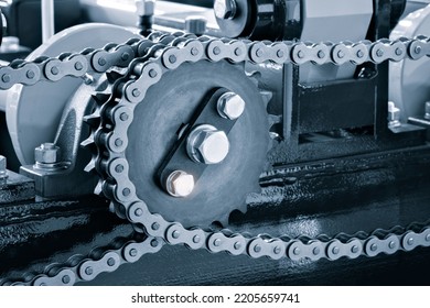 Gear chain drive shaft in conveyor belt is on production line. Timing chain of car, tensioners in engine. Industrial roller chain, technology. Team work, business industrial concept - Shutterstock ID 2205659741