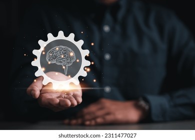 gear, cog, brain, idea, strategy, creativity, information, knowledge, imagination, creative. on hand showing the gear or cog in that's has brain and creativity idea strategy. information knowledge. - Shutterstock ID 2311477027