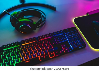 Gear equipment at gamer workspace - Rgb, keyboard, headphones and mouse