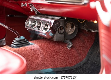 A Gear Lever And An Air Condition Of A Red Vintage Car