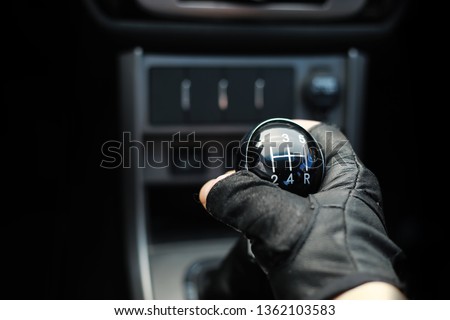 Gear lever. Manual Transmission. Hand on the gear shift in the car.